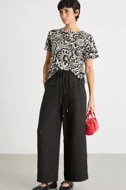 T-shirt con stampa all-over - Beige Nero